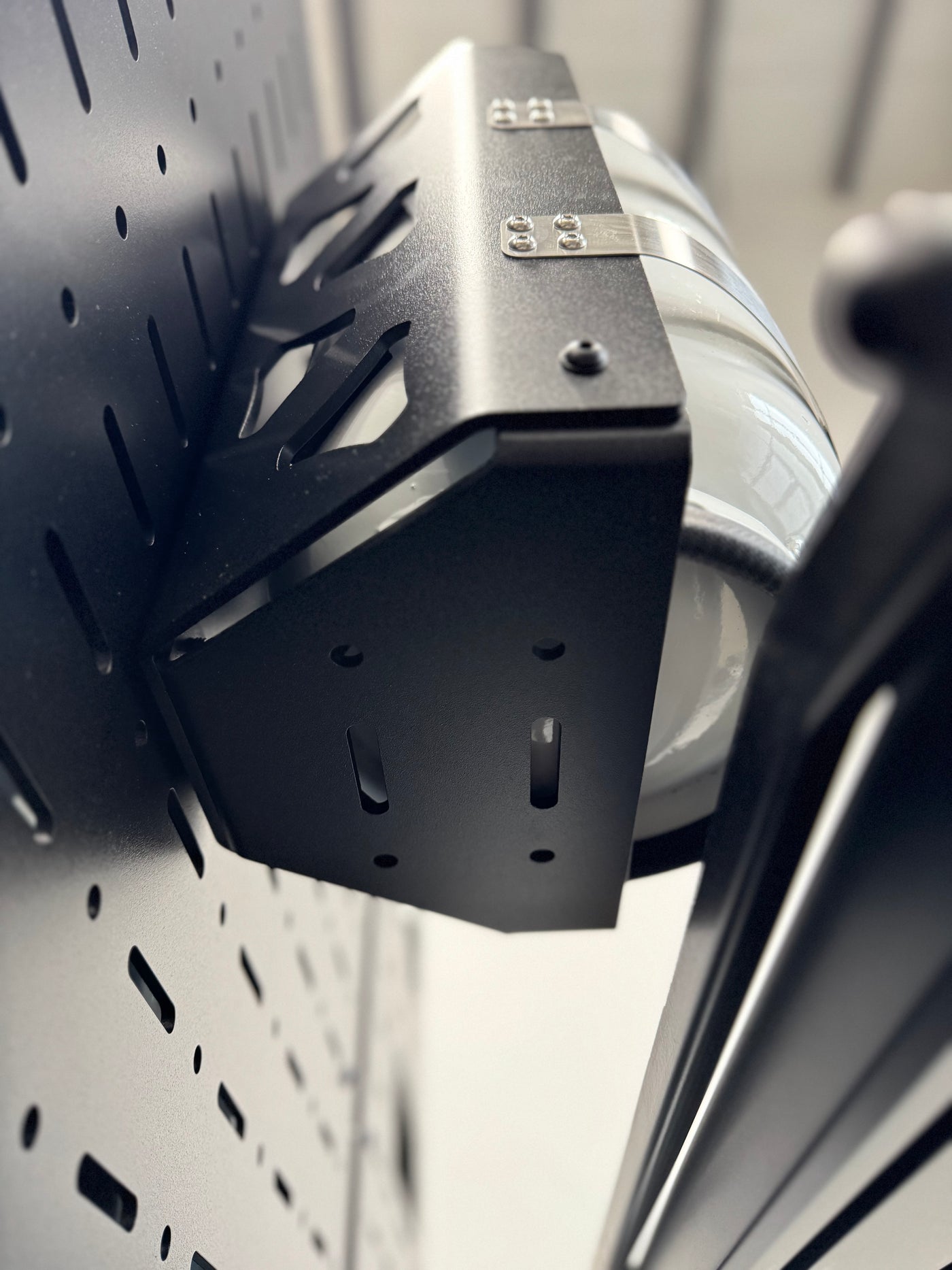 Aluminum propane tank bracket for overlanding and vans showing mounting options in bottom of bracket