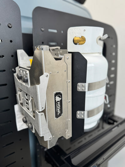 Close-up of Howl R1 mounted to rear Sprinter door carrier using Shuksan PS-10-HR1 Propane shuttle