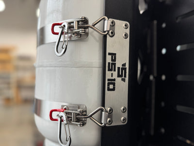 close-up of Shuksan PS-10 stainless badge on side of aluminum propane tank mount